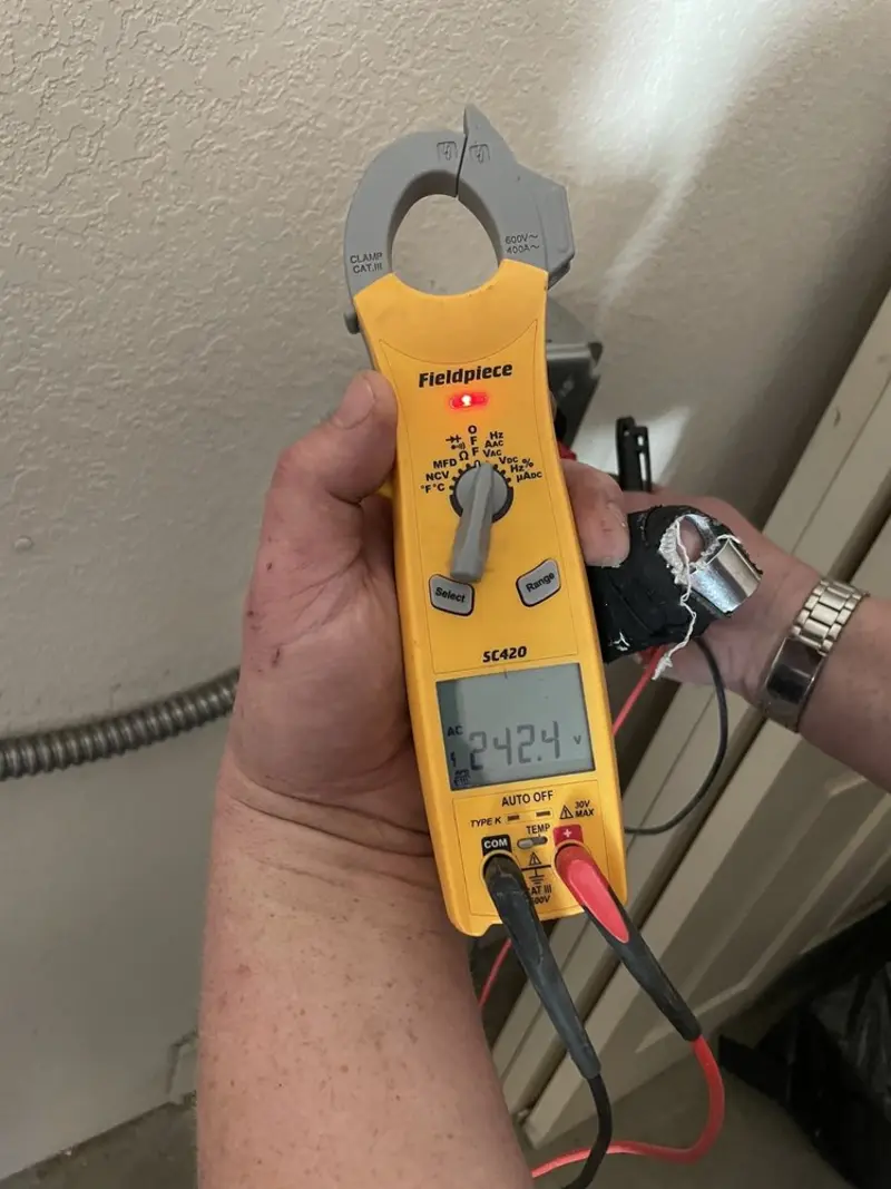 Voltage testing with clamp meter during Outlet Installation in Whiteville